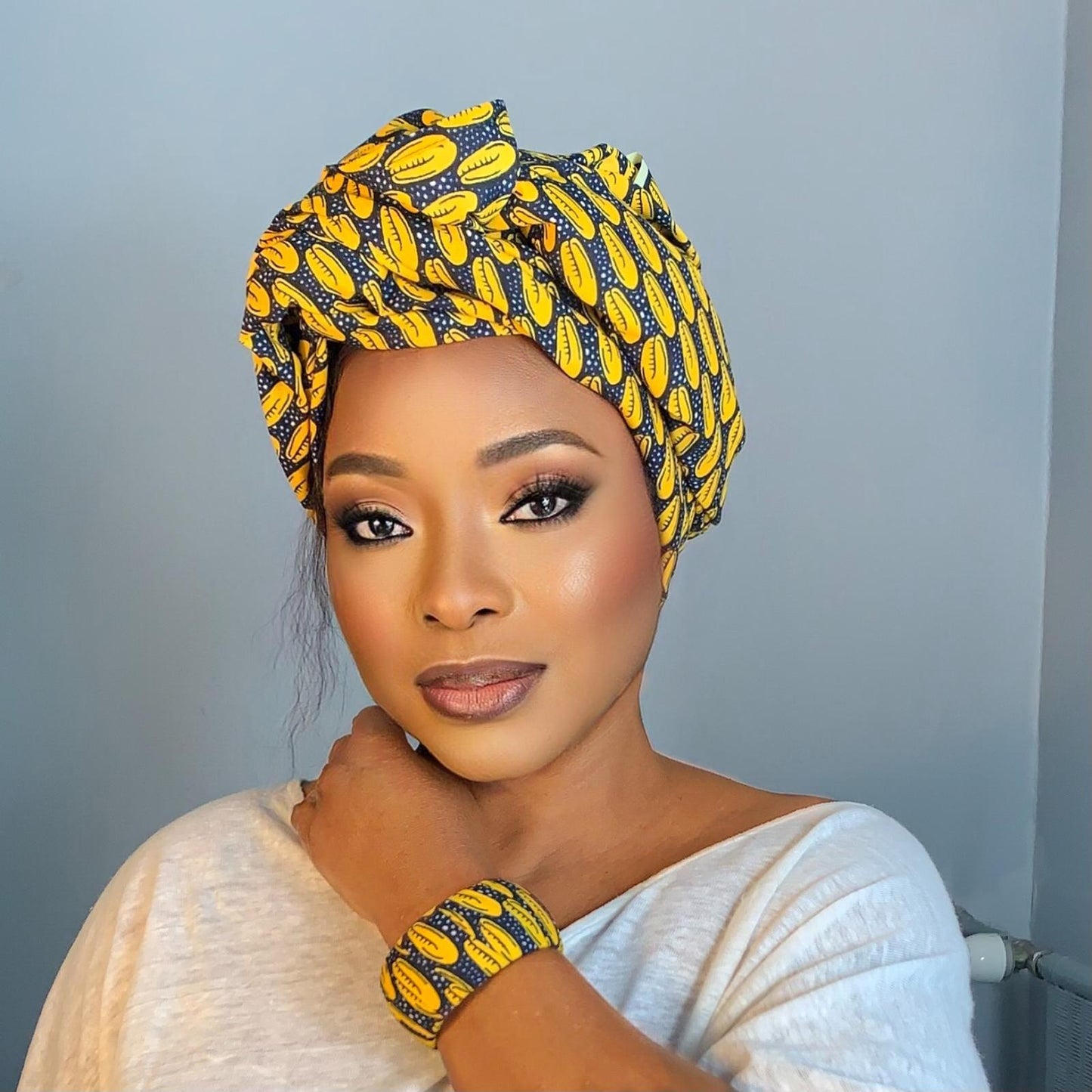 Fourlard turban motif Cauri Jaune en Wax Africain